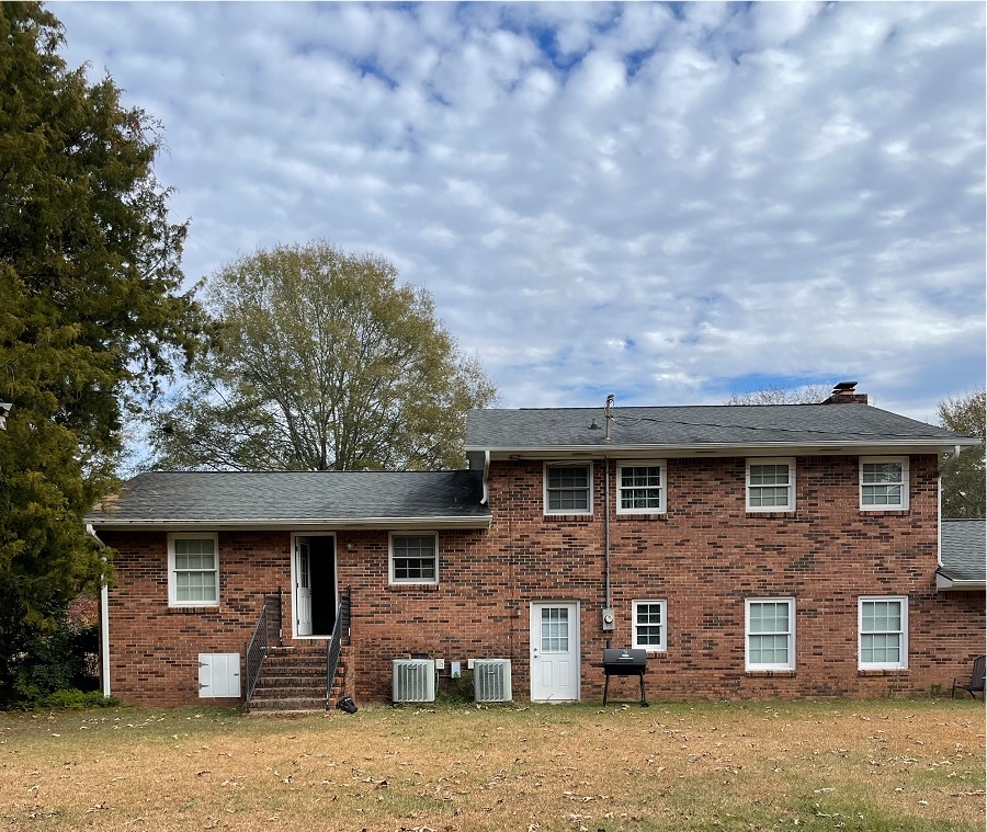 before image of back of brick house